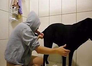 Doberman and a hot girl are both loving bestiality