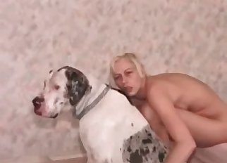 Amazing blonde jerks off her dog